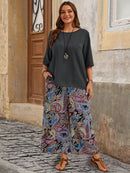 Conjunto Feminino camisa em gola redonda e calças de perna larga - Ligía. Plus Size